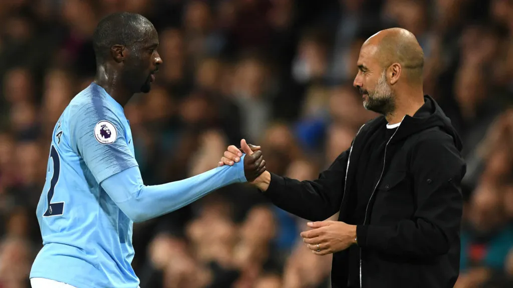 yaya-toure-pep-guardiola-manchester-city-2017-18_1e0a40zofj8ni1km47xzftb6wv-1024x576